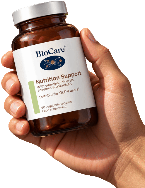 BioCare Nutrition Support, 90 vegetable capsules, held in a hand