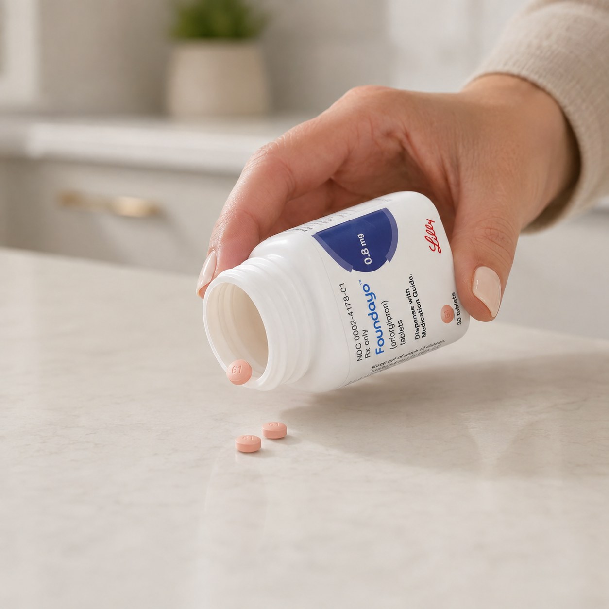 Foundayo tablets tipped from the pack onto a kitchen counter